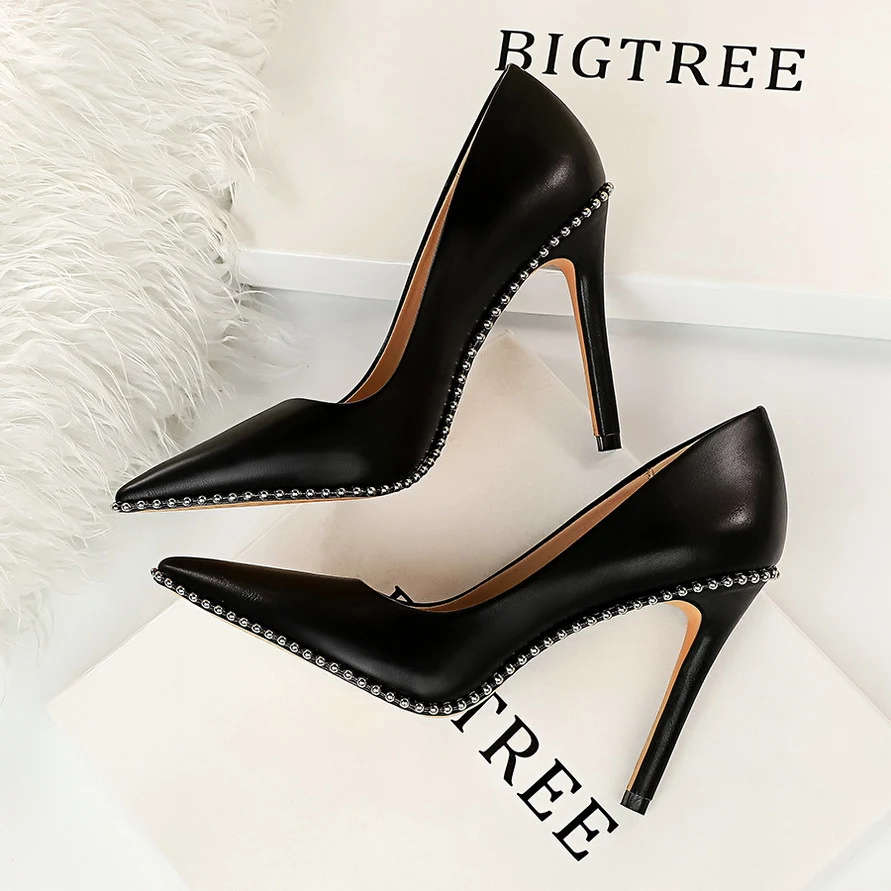 Studded high heels for a bold and sophisticated look. Elevate your style with these stunning shoes and make a statement. — photo 5