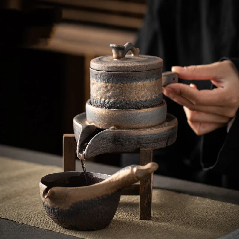 Gilded Iron Glaze Ceramic Tea Set Enjoy your tea in style with this elegant and durable set. Perfect for everyday use or — photo 1