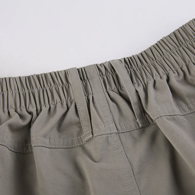 Short asymétrique taille basse pour femme, tissé et décontracté, idéal pour un look casual et confortable, parfait pour les journées ensoleillées. — photo 9