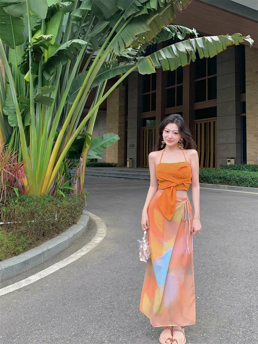 Title 2, Sleeveless tube top and orange tie-dye design n...
