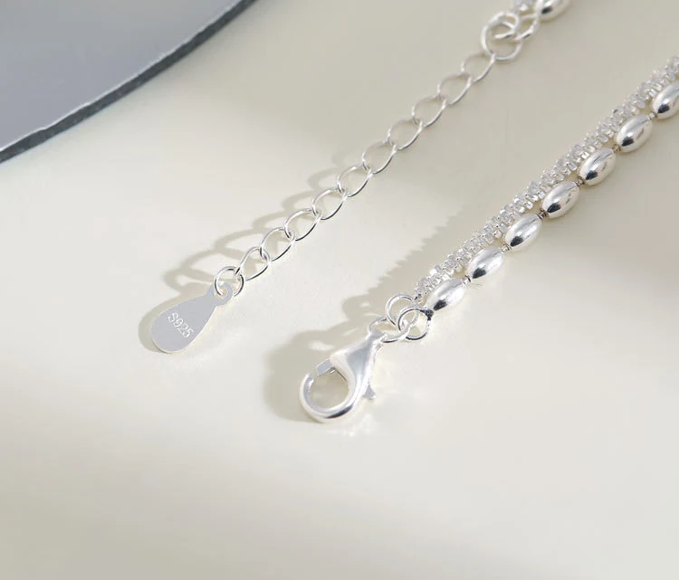 Pulseira dupla camada S925 prata com estrelas e feijões, personalidade única e design moderno para um visual elegante e sofisticado. — foto 2