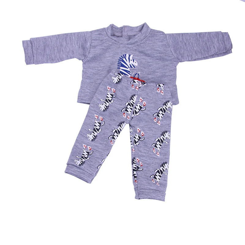 Boneca de 18 polegadas com conjunto de roupas com estampas de animais. Permite trocar roupas e estimular a criatividade e imaginação. — foto 3
