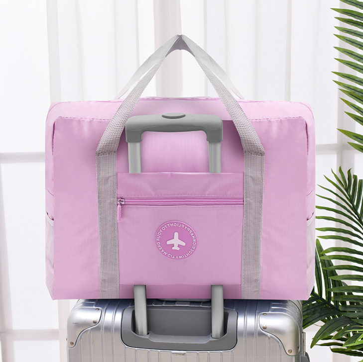 Travel solid color round bar package folding travel storage bag. Organize your clothes efficiently and travel with ease. — photo 4