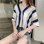 Oversized V-neck striped shirt for women, offering a comfortable and relaxed fit. Stylish and versatile, ideal for every — photo 1