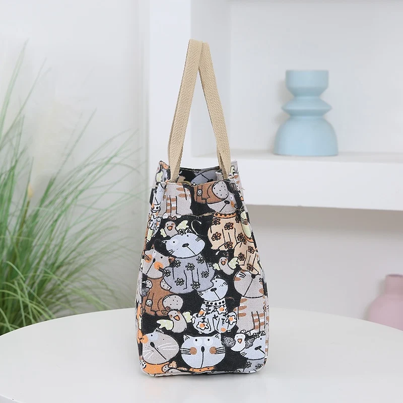 Bolsa de mão portátil feminina com desenho de desenho animado e grande capacidade. Leve tudo o que precisa com estilo e praticidade. — foto 2