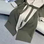 Cappotto di nicchia con design a silhouette lunga, antivento a contrasto di colore finto a due pezzi. Look alla moda e protezione dal vento. — foto 6