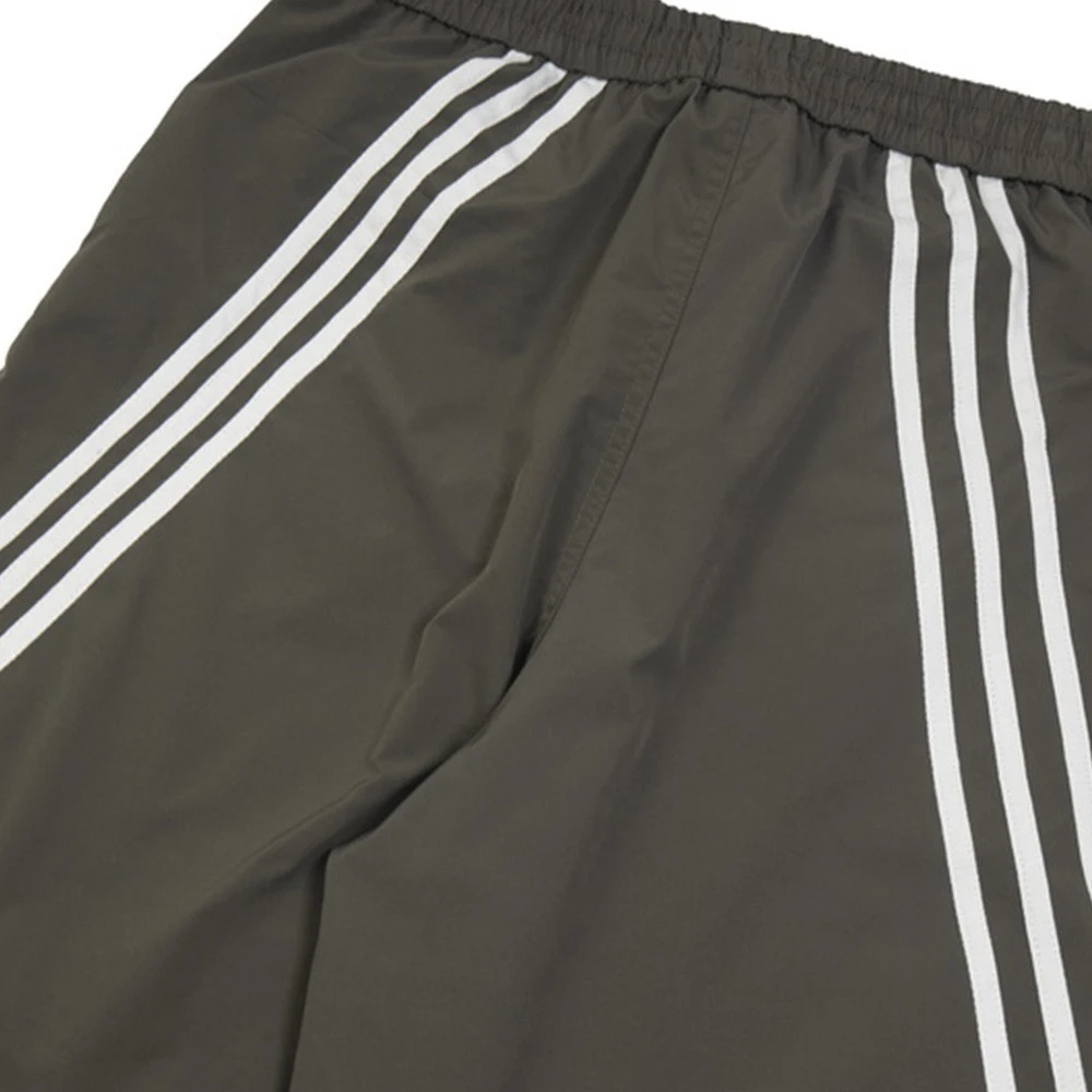Three Bars sportbroek met wijde pijpen. Biedt comfort en bewegingsvrijheid voor sport en vrijetijd. Perfect voor jouw actieve leven. — foto 41