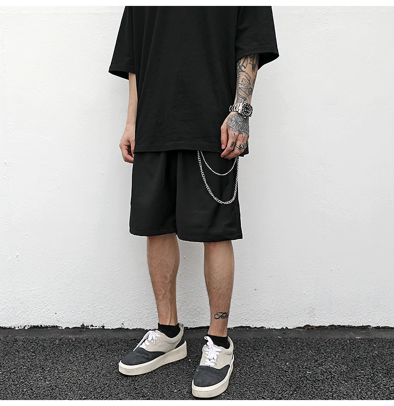 Trouser chain suit shorts, a bold statement in fashion. This stylish ensemble offers comfort and a unique look, perfect — photo 1
