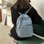 Mochila feminina de lona jeans lavada, perfeita para uso diário e viagens. Confortável, espaçosa e resistente, ideal para transportar seus pertences. — foto 7