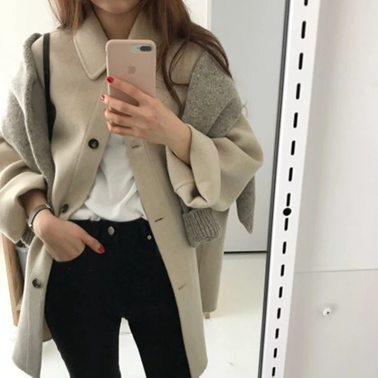 Title 2, Ladies mid-length woolen coat, offering warmth ...
