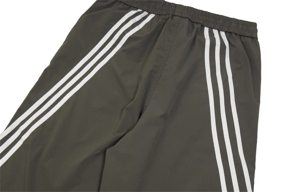 Three Bars sportbroek met wijde pijpen. Biedt comfort en bewegingsvrijheid voor sport en vrijetijd. Perfect voor jouw actieve leven. — foto 19