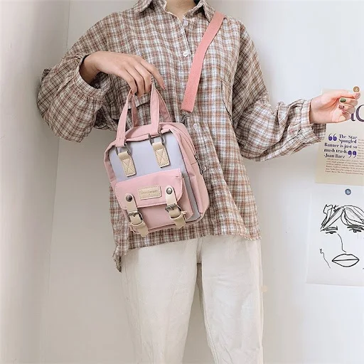 Title 12, Mini mochila crossbody de uso duplo — Leve seus...