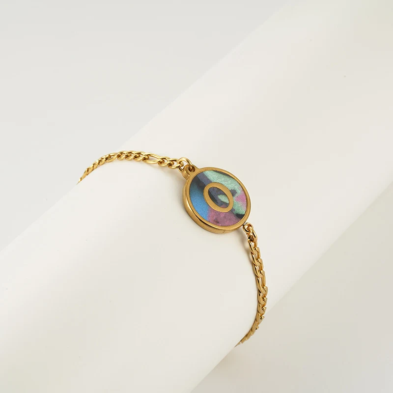 Title 12, Bracciale tondo in acciaio inossidabile con let...