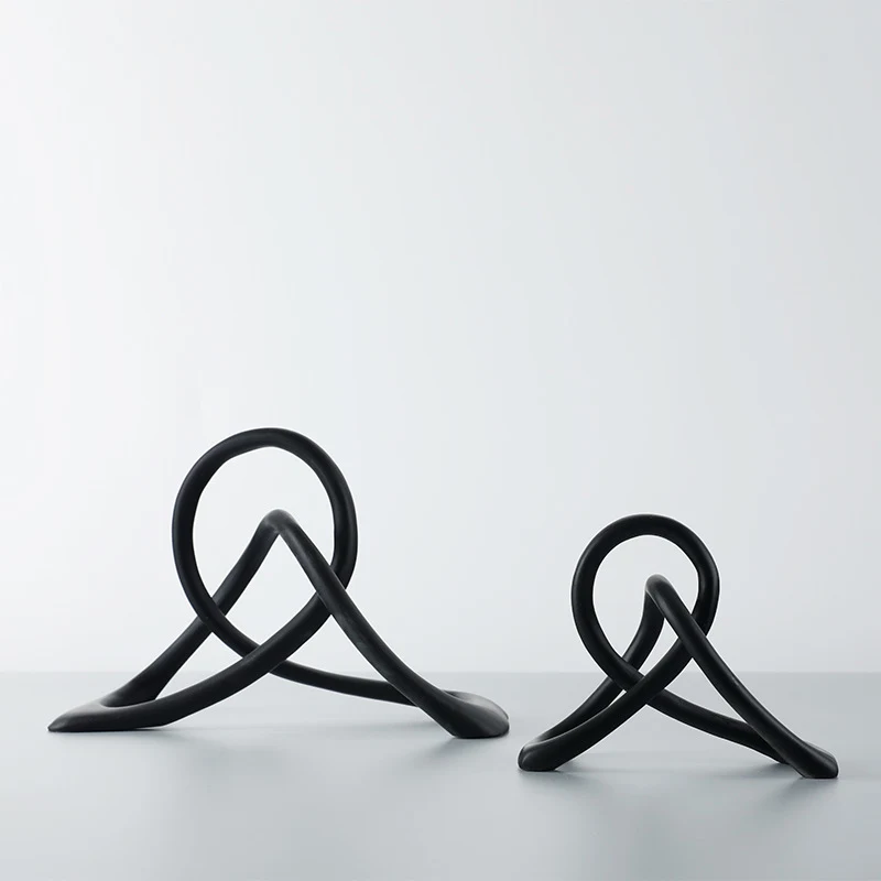 Simple and modern black resin twisted knot abstract geometric ornaments, perfect for home or office decor, adding a touc — photo 6