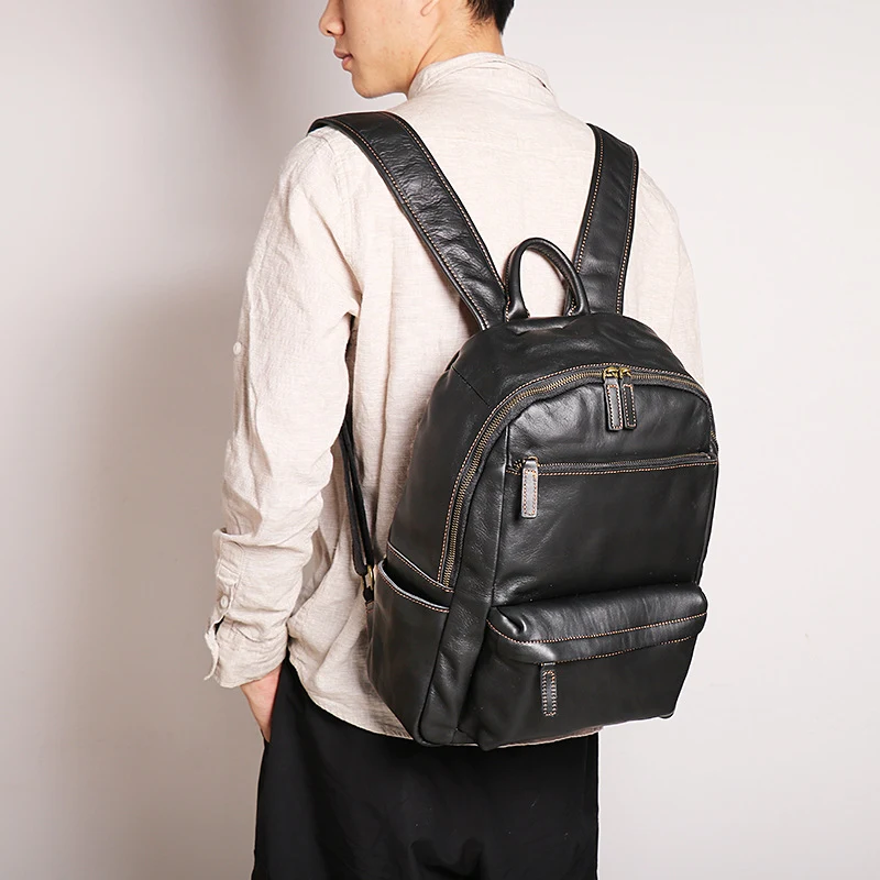Mochila de couro para notebook 14 polegadas masculina, ideal para viagens ao ar livre. Durável, espaçosa e elegante. Perfeita para o uso diário e aventuras. — foto 1