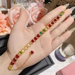 Pulseira feminina com banho de ouro 18K e gemas de turmalina coloridas, perfeita para adicionar um toque de elegância e cor ao seu visual. — foto 5