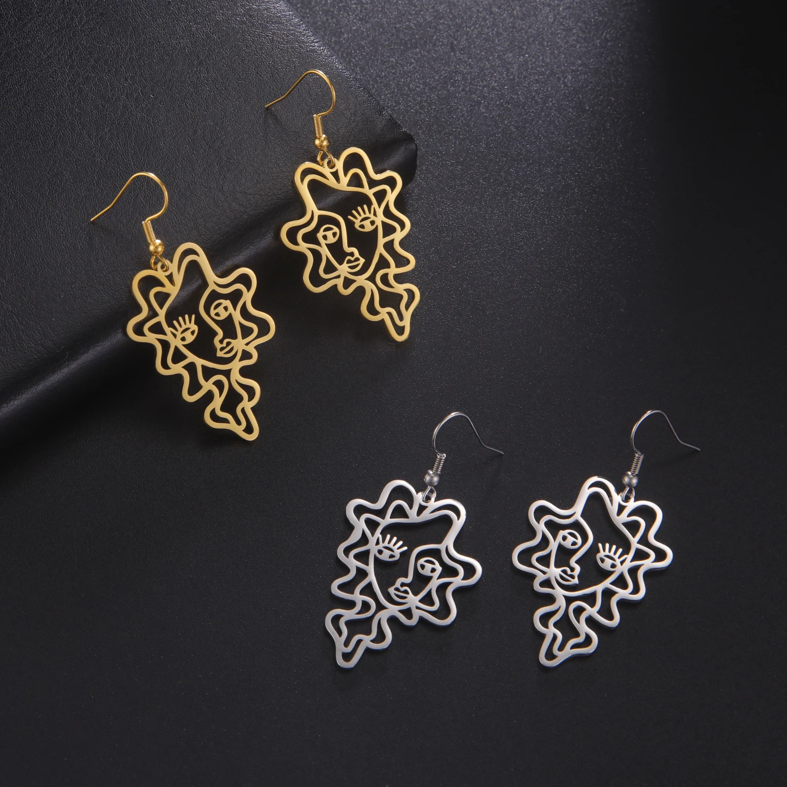 Brincos femininos de onda estilo étnico retrô de aço titânio. Design exclusivo, confortáveis e ideais para um visual boêmio elegante. — foto 5