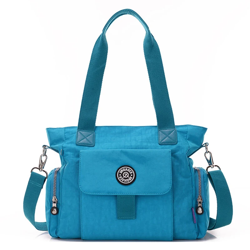 Lichtgewicht waterdichte nylon schoudertas, messenger bag. Ideaal voor dagelijks gebruik, reizen en beschermt je spullen tegen regen en andere weersomstandigheden. — foto 14