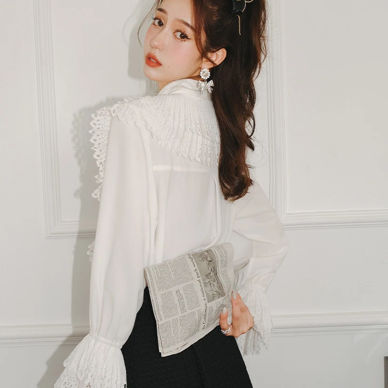 Title 4, Lace Ins Tide Flared Sleeves Loose Shirt. A com...