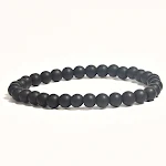 Pulseira de contas de hematita, pedra vulcânica polida e contas de madeira. Equilíbrio natural e elegância. — foto 1