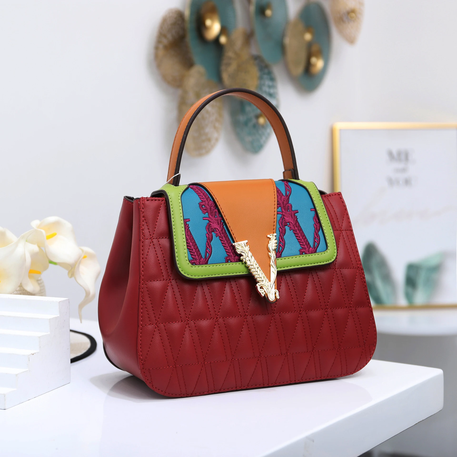 Title 1, Contrasting color handbag for a vibrant style. ...