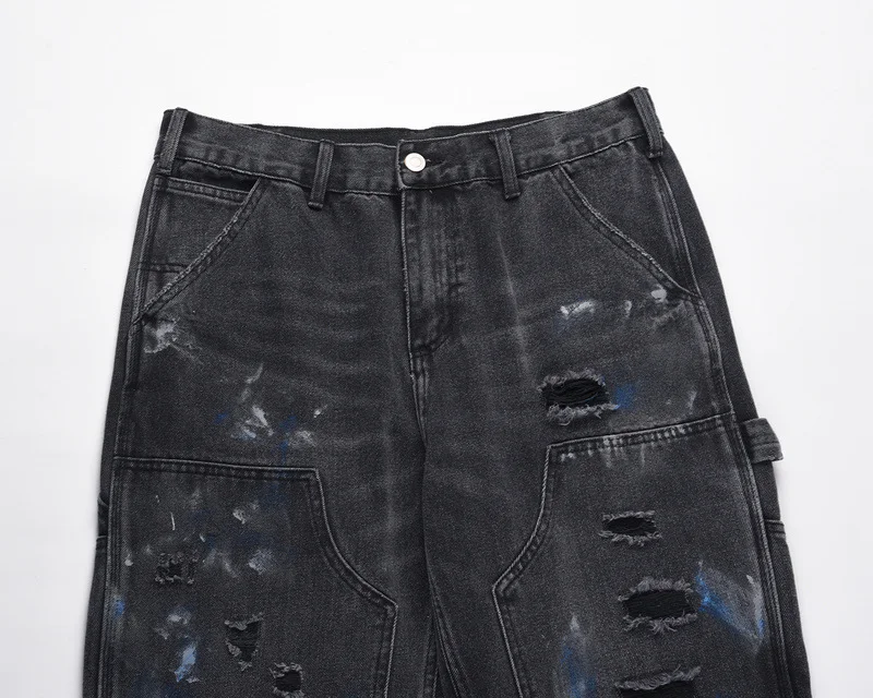 Title 3, Washed ink splattered ripped black zip-up jeans...