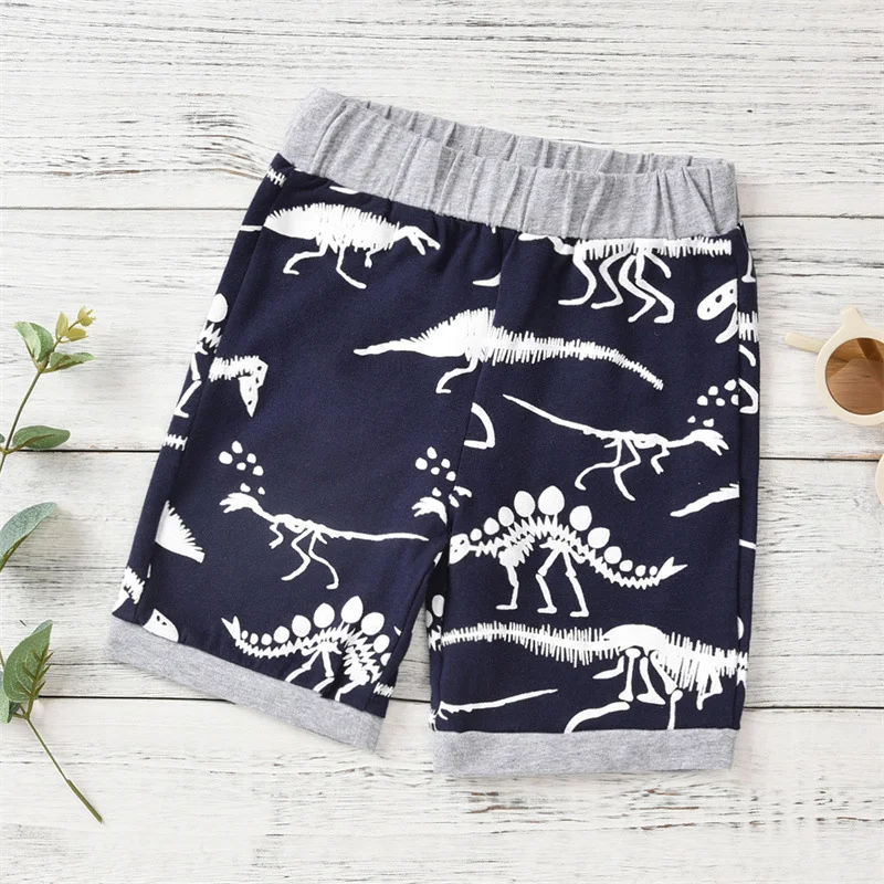 Zomerse kinderkleding met dinosaurus print, korte mouwen, ademend en licht. Perfect om in te spelen tijdens de warme zomerdagen, comfortabel — foto 9