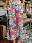 Calças femininas soltas com estampa floral e cordão. Conforto e estilo para o dia a dia. Perfeitas para um visual leve e moderno. — foto 8