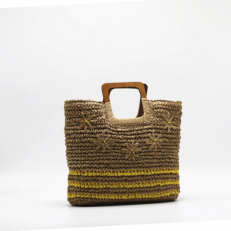 Bolsa de mão com bordado floral e grama tecida, um acessório elegante e prático para carregar seus itens essenciais com estilo e charme, perfeita para o dia a dia. — foto 1