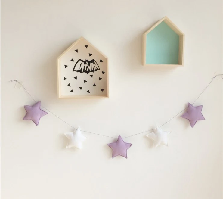 Star and moon string ornaments to decorate your home. Create magical and festive atmospheres with these charming hanging — photo 11