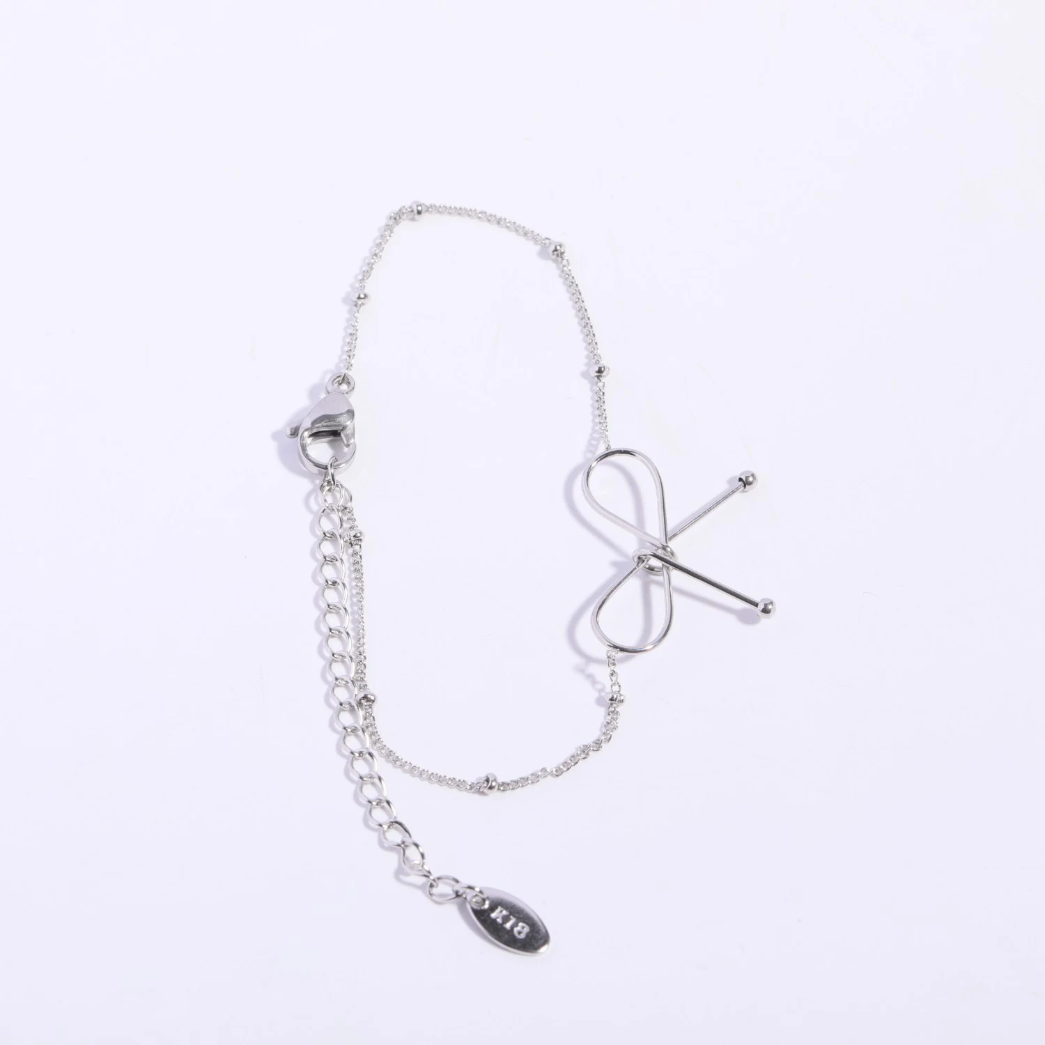 Conjunto feminino de joias com colar de clavícula e pulseira com laço, perfeito para combinar com qualquer roupa. Realce sua beleza e elegância. — foto 1