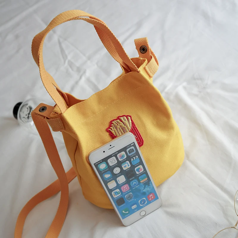 Bolsa de ombro de lona estilo Japão e Coreia, simples e tipo saco, ideal para escola, compras e estudantes. Design moderno e funcional! — foto 3