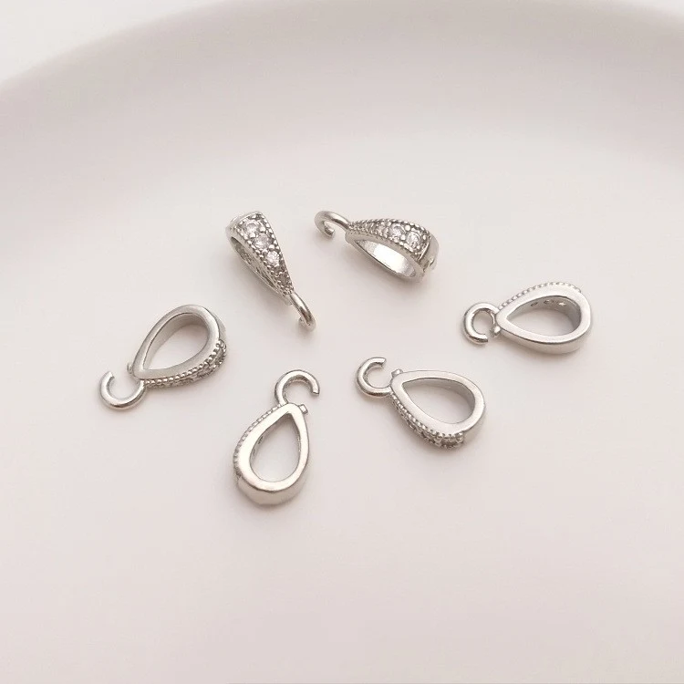 Fivela oval de zircônia com banho de ouro 18K e folheação em ouro 14K. Adicione um toque de sofisticação aos seus projetos com ela. — foto 10