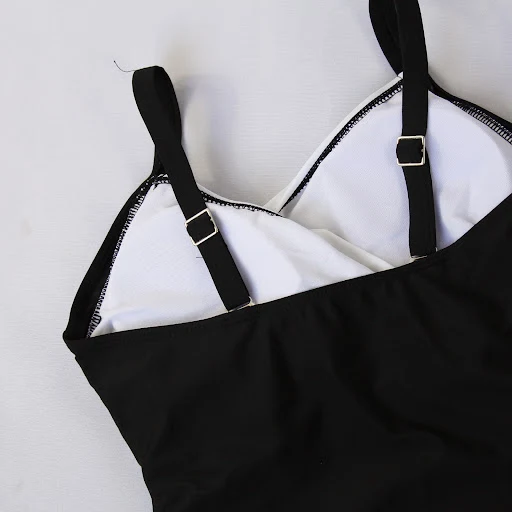 Title 3, Black and white one-piece swimsuit Timeless ele...