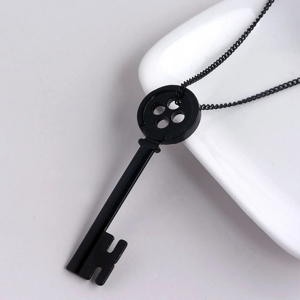 Chave preta de presente para abrir lembranças e celebrar momentos especiais. Um presente único e simbólico, perfeito para ocasiões marcantes. — foto 2
