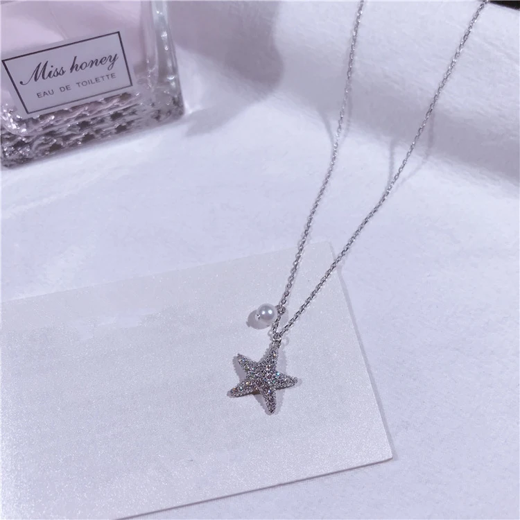 Colar de estrela do mar em prata esterlina S925 com pérola e micro-diamantes cravejados. Adicione brilho e elegância ao seu visual. — foto 8