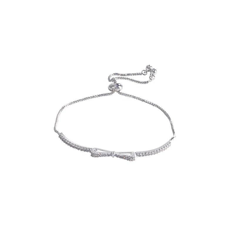 Pulseira de laço feminina com micro zircônias incrustadas. Design requintado e delicado, um acessório perfeito para mulheres. — foto 1