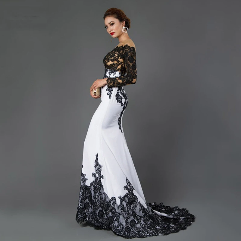 Vestido longo de renda bordada com cauda sereia, corte justo. Elegância e sofisticação para eventos especiais, realçando sua beleza e forma. — foto 2