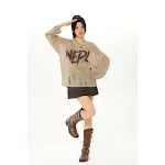 Camiseta de malha jeans rasgados retro, top solto e emagrecador. Combine estilo vintage com conforto e valorize sua silhueta. — foto 6