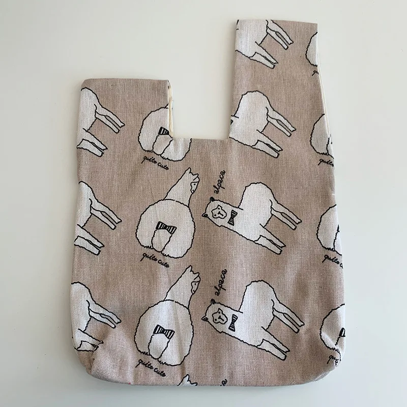 Bolsa de pulso em linho estampado multicolorido estilo japonês, ideal para transportar seus itens essenciais com praticidade e um toque de elegância. — foto 23