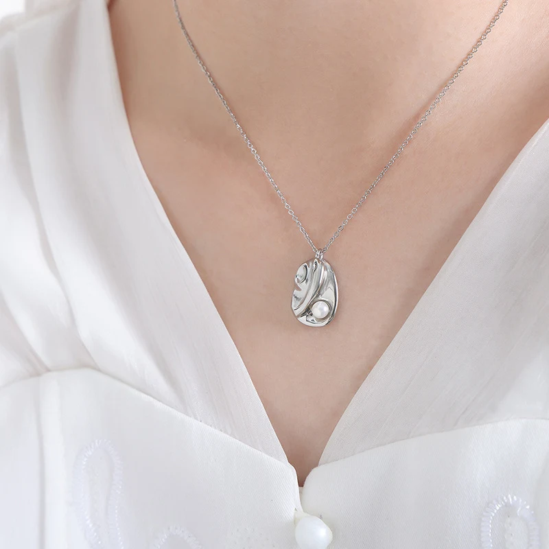 Colar com pingente de aço titânio geométrico irregular retrô, pérola estilo Ins. Um acessório de moda elegante e sofisticado para mulheres. — foto 7