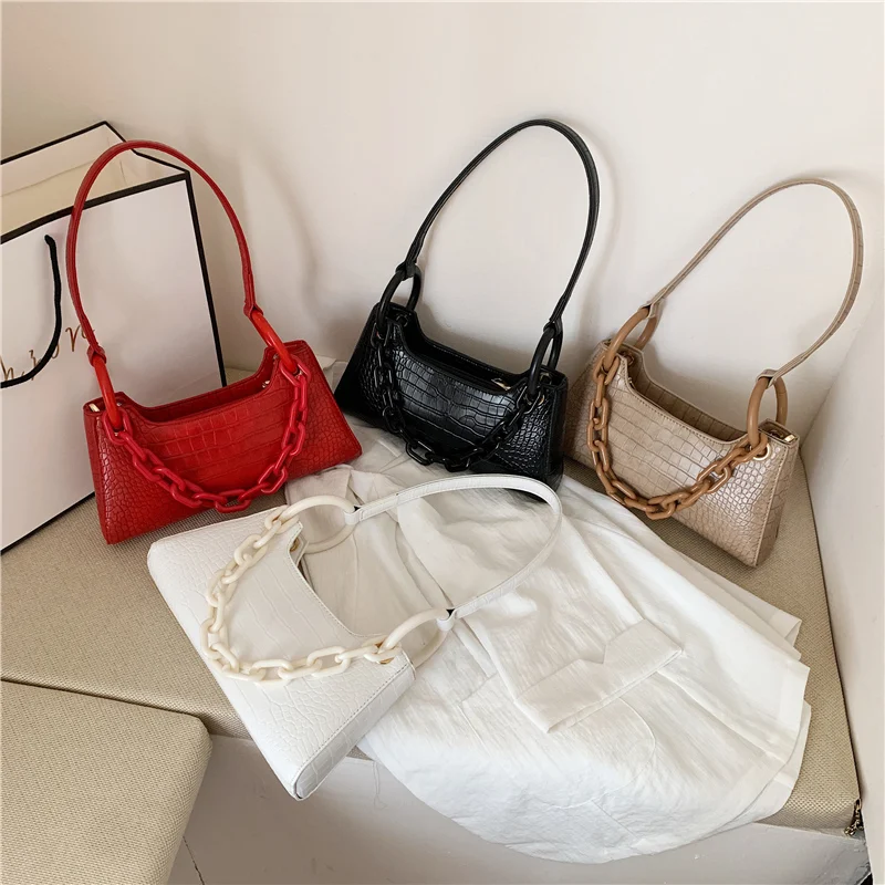Bolsa de ombro feminina moderna e elegante, perfeita para usar sob o braço. Combine estilo e praticidade para um visual charmoso e confortável em qualquer ocasião. — foto 1