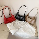 Bolsa de ombro feminina moderna e elegante, perfeita para usar sob o braço. Combine estilo e praticidade para um visual charmoso e confortável em qualquer ocasião. — foto 1