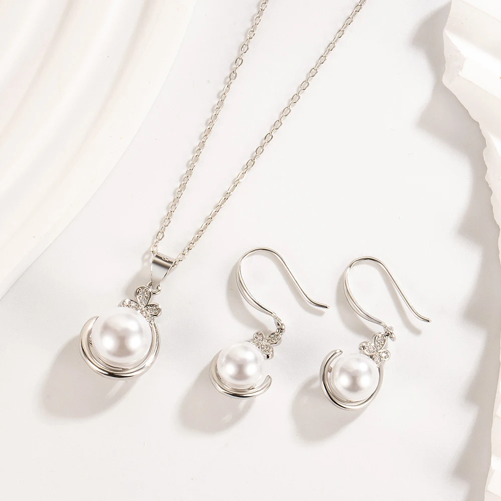 Conjunto simples de colar e brincos de pérolas para mulheres, ideal para adicionar um toque de elegância sutil e atemporal ao seu visual. — foto 2