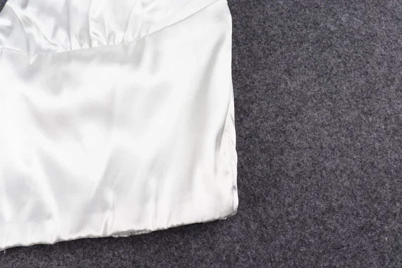 Title 18, Wear a small backless vest for a stylish, moder...
