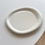 Korean Style White Fat Edge Ceramic Plate. Elevate your dining experience with this stylish plate, perfect for elegant f — photo 10