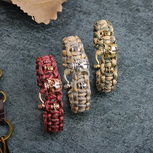 Title 2, Pulseira de paracord 7 núcleos com peças de cob...