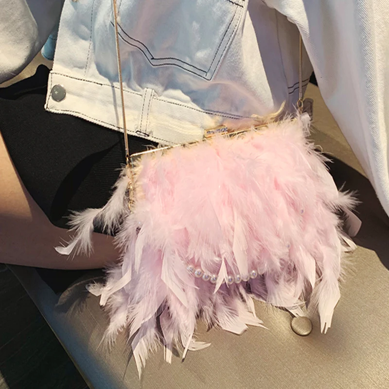 Title 4, Ostrich hair clip buckle pearl diagonal bag. A ...
