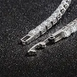 Eenvoudige armband met twee rijen van drie fonkelende zirkonen, een subtiele glans voor elke outfit — foto 1