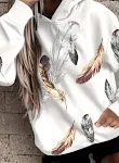 Moletom feminino solto com estampa de penas e mangas compridas, ideal para um look casual e confortável. Perfeito para o dia a dia. — foto 1